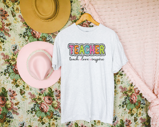 Teach Love Inspire Graphic Tee