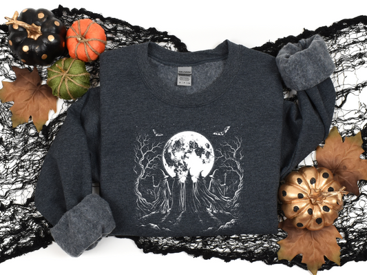 Dark Heather Gildan crewneck with moonlit witches graphic